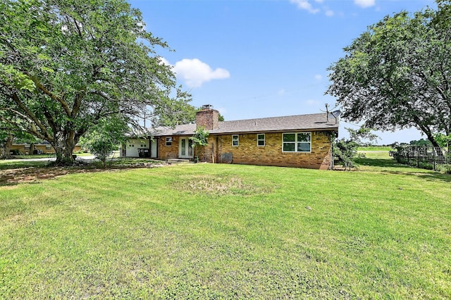 12906 Fm 902, Dorchester, TX 75459 - rear view of property featuring a yard, a chimney, and brick siding