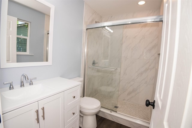 401 Miller St, Bowie, TX 76230 - bathroom featuring a stall shower, vanity, recessed lighting, and wood finished floors