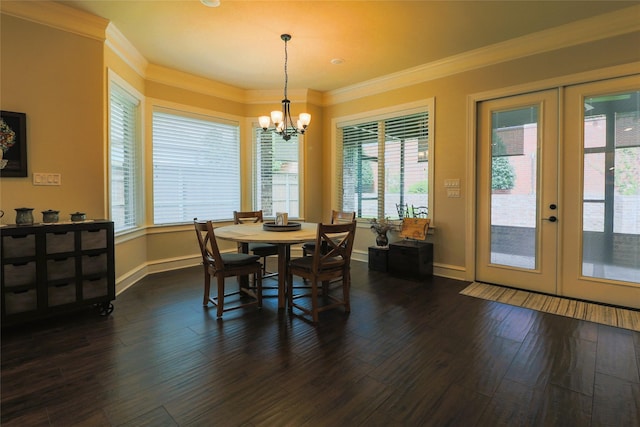 6923 Saint Anthony Dr, Tyler, TX 75703 - dining space featuring french doors, a chandelier, ornamental molding, and dark wood finished floors