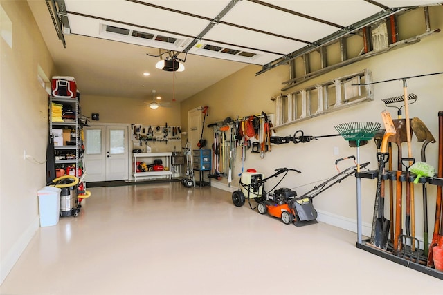 6923 Saint Anthony Dr, Tyler, TX 75703 - garage featuring a garage door opener and baseboards
