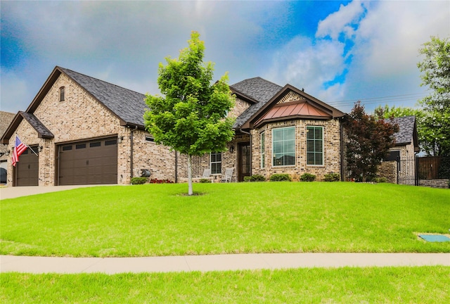 6923 Saint Anthony Dr, Tyler, TX 75703 - view of front of property with a front yard, a garage, brick siding, and driveway