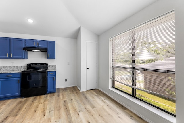 6325 Brookhaven Trl, Fort Worth, TX 76133 - kitchen with electric range, blue cabinetry, under cabinet range hood, plenty of natural light, and lofted ceiling