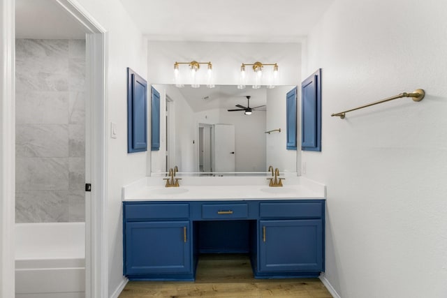 6325 Brookhaven Trl, Fort Worth, TX 76133 - bathroom featuring double vanity, ceiling fan, wood finished floors, and bathing tub / shower combination