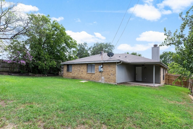 6325 Brookhaven Trl, Fort Worth, TX 76133 - rear view of house featuring a fenced backyard, a chimney, a patio, and brick siding
