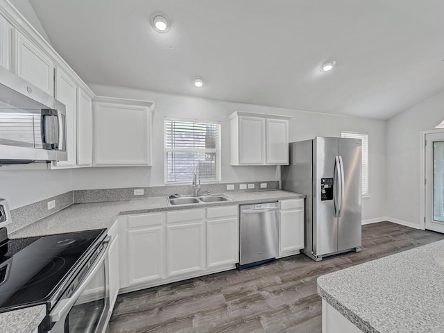 8705 Autumn Creek Trl, Fort Worth, TX 76134 - kitchen featuring appliances with stainless steel finishes, white cabinets, wood finished floors, light countertops, and recessed lighting