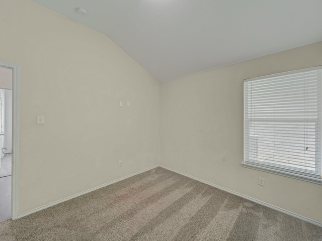 8705 Autumn Creek Trl, Fort Worth, TX 76134 - empty room with carpet flooring, vaulted ceiling, and a smoke detector
