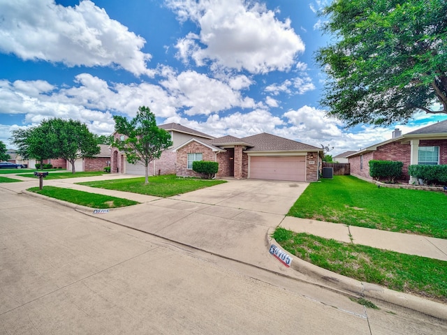 8705 Autumn Creek Trl, Fort Worth, TX 76134 - view of front of home with driveway, an attached garage, and brick siding
