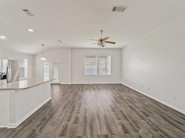 8705 Autumn Creek Trl, Fort Worth, TX 76134 - unfurnished living room with wood finished floors, a ceiling fan, lofted ceiling, and recessed lighting