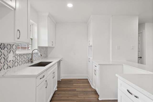 2511 Gregory Dr, Mesquite, TX 75150 - kitchen with dark wood-style flooring, tasteful backsplash, recessed lighting, and white cabinetry