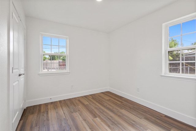 2511 Gregory Dr, Mesquite, TX 75150 - spare room featuring plenty of natural light and wood finished floors