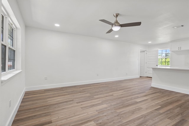2511 Gregory Dr, Mesquite, TX 75150 - unfurnished room featuring light wood finished floors, ceiling fan, and recessed lighting