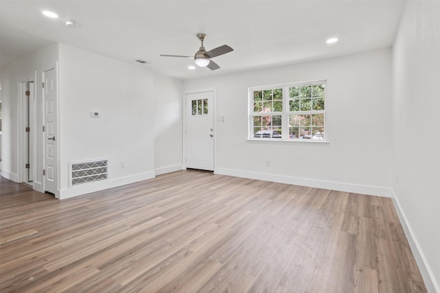 2511 Gregory Dr, Mesquite, TX 75150 - unfurnished living room featuring light wood-style floors, ceiling fan, and recessed lighting