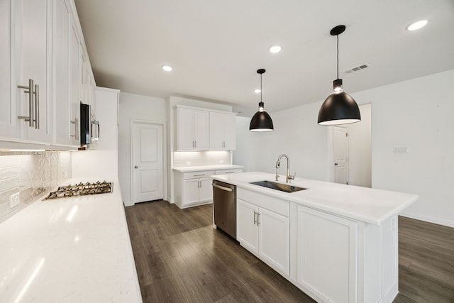 2819 Grand Lookout Ln, Arlington, TX 76001 - kitchen featuring appliances with stainless steel finishes, decorative backsplash, dark wood finished floors, and recessed lighting