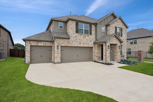 2819 Grand Lookout Ln, Arlington, TX 76001 - view of front facade with driveway, roof with shingles, a garage, and stucco siding