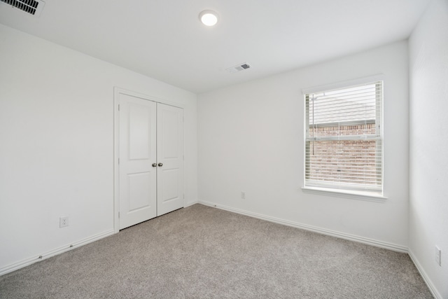 2819 Grand Lookout Ln, Arlington, TX 76001 - unfurnished bedroom featuring carpet flooring and a closet
