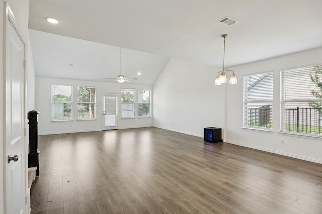 2819 Grand Lookout Ln, Arlington, TX 76001 - unfurnished living room with wood finished floors, lofted ceiling, ceiling fan, and recessed lighting