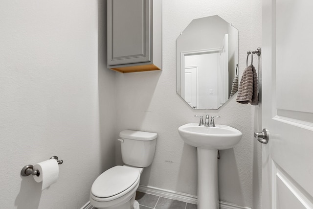 18137 Lakefront Ct, Forney, TX 75126 - half bath with toilet and tile patterned floors