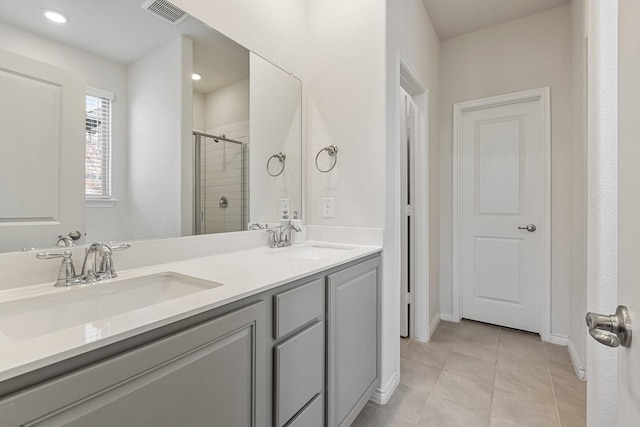 18137 Lakefront Ct, Forney, TX 75126 - full bath featuring a stall shower, double vanity, tile patterned floors, and recessed lighting