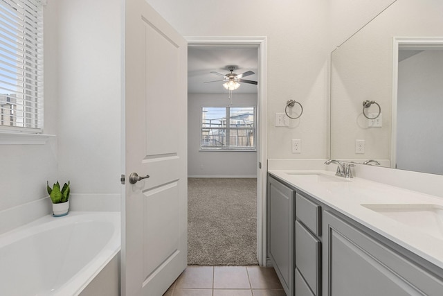 18137 Lakefront Ct, Forney, TX 75126 - bathroom with ceiling fan, double vanity, a bath, and tile patterned flooring