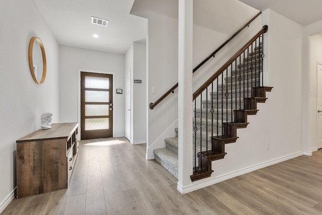 18137 Lakefront Ct, Forney, TX 75126 - entrance foyer featuring wood finished floors, stairway, and recessed lighting