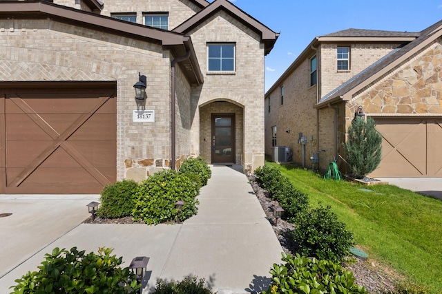 18137 Lakefront Ct, Forney, TX 75126 - view of front of house with stone siding, a garage, and brick siding