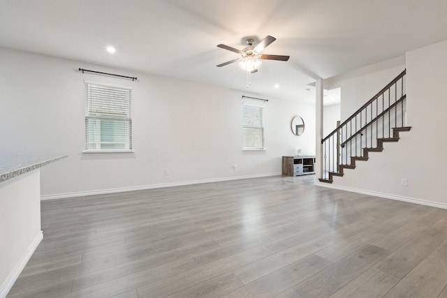 18137 Lakefront Ct, Forney, TX 75126 - unfurnished living room with a ceiling fan, wood finished floors, stairs, and recessed lighting