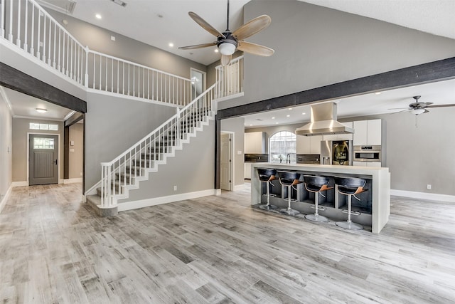 6111 Pinwood Cir, Arlington, TX 76001 - living room with a high ceiling, a ceiling fan, stairs, healthy amount of natural light, and recessed lighting
