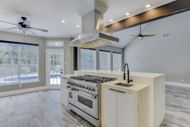 6111 Pinwood Cir, Arlington, TX 76001 - kitchen featuring island range hood, ceiling fan, double oven range, light wood-style flooring, and recessed lighting