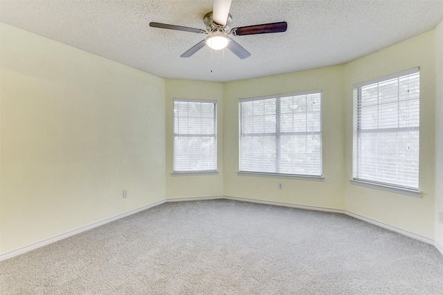 6111 Pinwood Cir, Arlington, TX 76001 - carpeted empty room featuring plenty of natural light, a textured ceiling, and ceiling fan