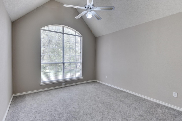 6111 Pinwood Cir, Arlington, TX 76001 - carpeted empty room featuring healthy amount of natural light, ceiling fan, lofted ceiling, and a textured ceiling