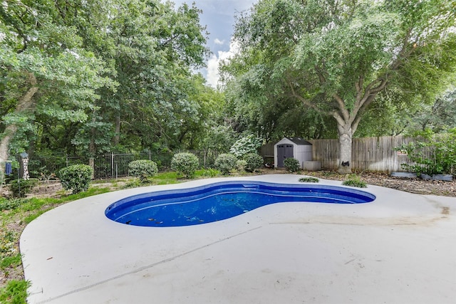 6111 Pinwood Cir, Arlington, TX 76001 - view of pool with a storage shed, a fenced backyard, and a patio