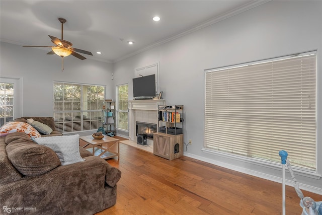 118 Otto Ln, Shreveport, LA 71105 - living area with ornamental molding, ceiling fan, recessed lighting, hardwood / wood-style floors, and a tiled fireplace