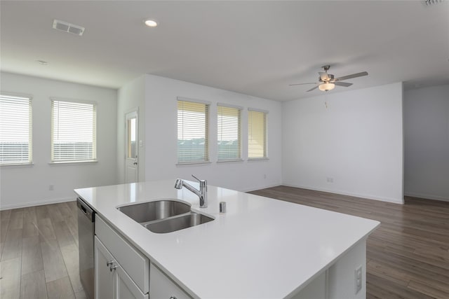 204 Post Oak St, Azle, TX 76020 - kitchen featuring a ceiling fan, stainless steel dishwasher, light countertops, open floor plan, and dark wood-style flooring