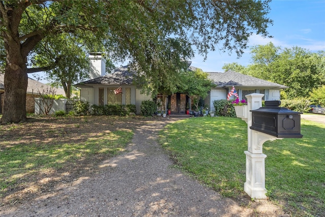 1605 Lamberth Cir, Sherman, TX 75092 - view of front of home with a chimney, a front lawn, and roof with shingles