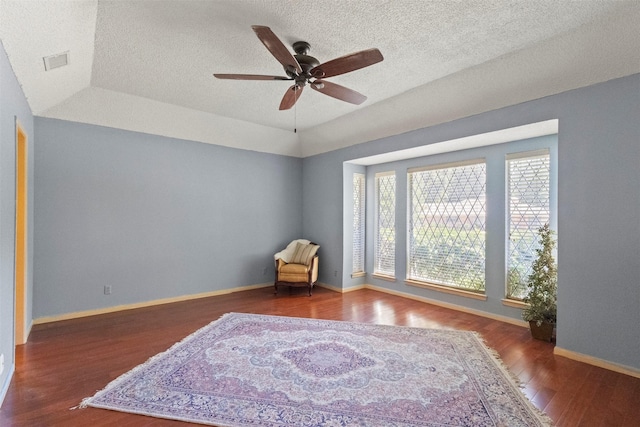 1605 Lamberth Cir, Sherman, TX 75092 - living area with wood finished floors, a ceiling fan, and a textured ceiling