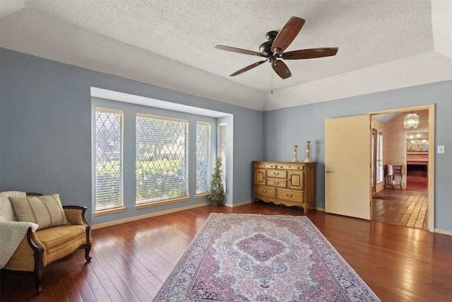 1605 Lamberth Cir, Sherman, TX 75092 - living area with wood-type flooring, ceiling fan, a textured ceiling, and a chandelier