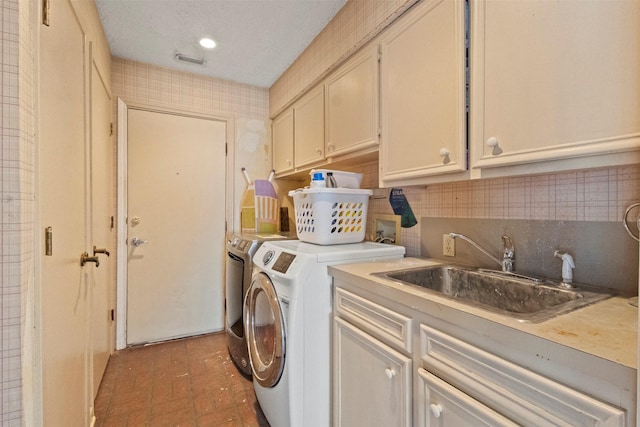 1605 Lamberth Cir, Sherman, TX 75092 - washroom featuring cabinet space and washing machine and clothes dryer