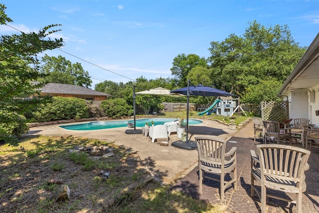 1605 Lamberth Cir, Sherman, TX 75092 - view of swimming pool with a playground, a water slide, a patio area, and a fenced backyard