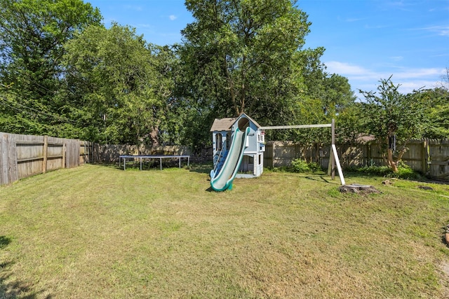 1605 Lamberth Cir, Sherman, TX 75092 - fenced backyard with a trampoline and a playground