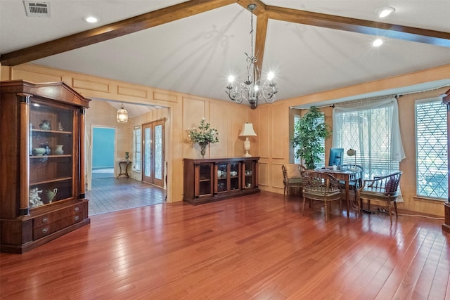 1605 Lamberth Cir, Sherman, TX 75092 - dining room with wood finished floors, a desk, a chandelier, healthy amount of natural light, and a decorative wall