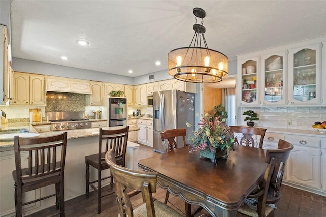 1605 Lamberth Cir, Sherman, TX 75092 - dining area featuring a chandelier, brick patterned floors, and recessed lighting