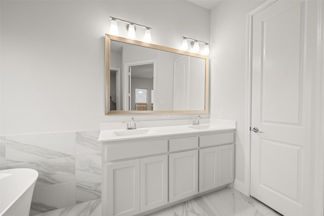 2297 High Plain Ln, Waxahachie, TX 75167 - full bathroom with marble look tile flooring, double vanity, and a freestanding tub