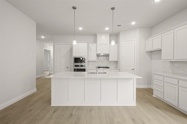 2297 High Plain Ln, Waxahachie, TX 75167 - kitchen with stainless steel appliances, backsplash, white cabinets, light countertops, and recessed lighting