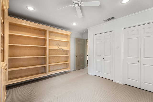 505 Buckingham Pl, Tyler, TX 75701 - unfurnished bedroom featuring ornamental molding, recessed lighting, light colored carpet, a ceiling fan, and multiple closets