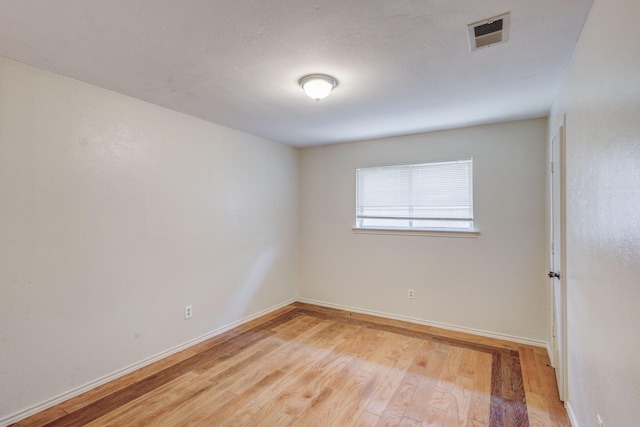 7305 Ridgeview Dr, Rowlett, TX 75089 - unfurnished room with light wood-style flooring and baseboards