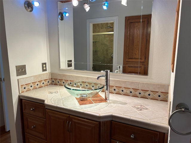 216 Lemon Dr, Arlington, TX 76018 - bathroom featuring vanity, an enclosed shower, and backsplash