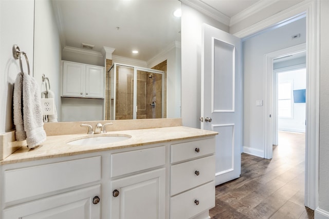 3303 Blackburn St Unit 308, Dallas, TX 75204 - full bath featuring a shower stall, crown molding, vanity, and wood finished floors