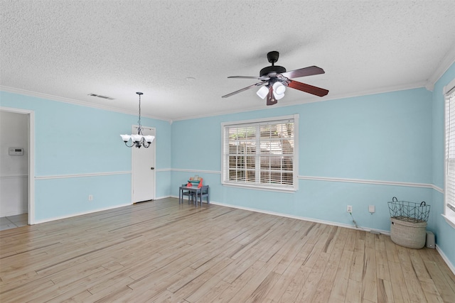 6737 Oliver Dr, North Richland Hills, TX 76180 - unfurnished living room with a textured ceiling, a chandelier, wood finished floors, a ceiling fan, and ornamental molding