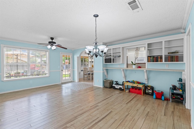 6737 Oliver Dr, North Richland Hills, TX 76180 - rec room with a chandelier, a textured ceiling, arched walkways, ceiling fan, and wood finished floors