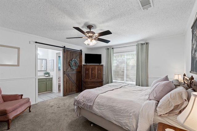 6737 Oliver Dr, North Richland Hills, TX 76180 - bedroom with a barn door, light carpet, ensuite bath, ornamental molding, and ceiling fan